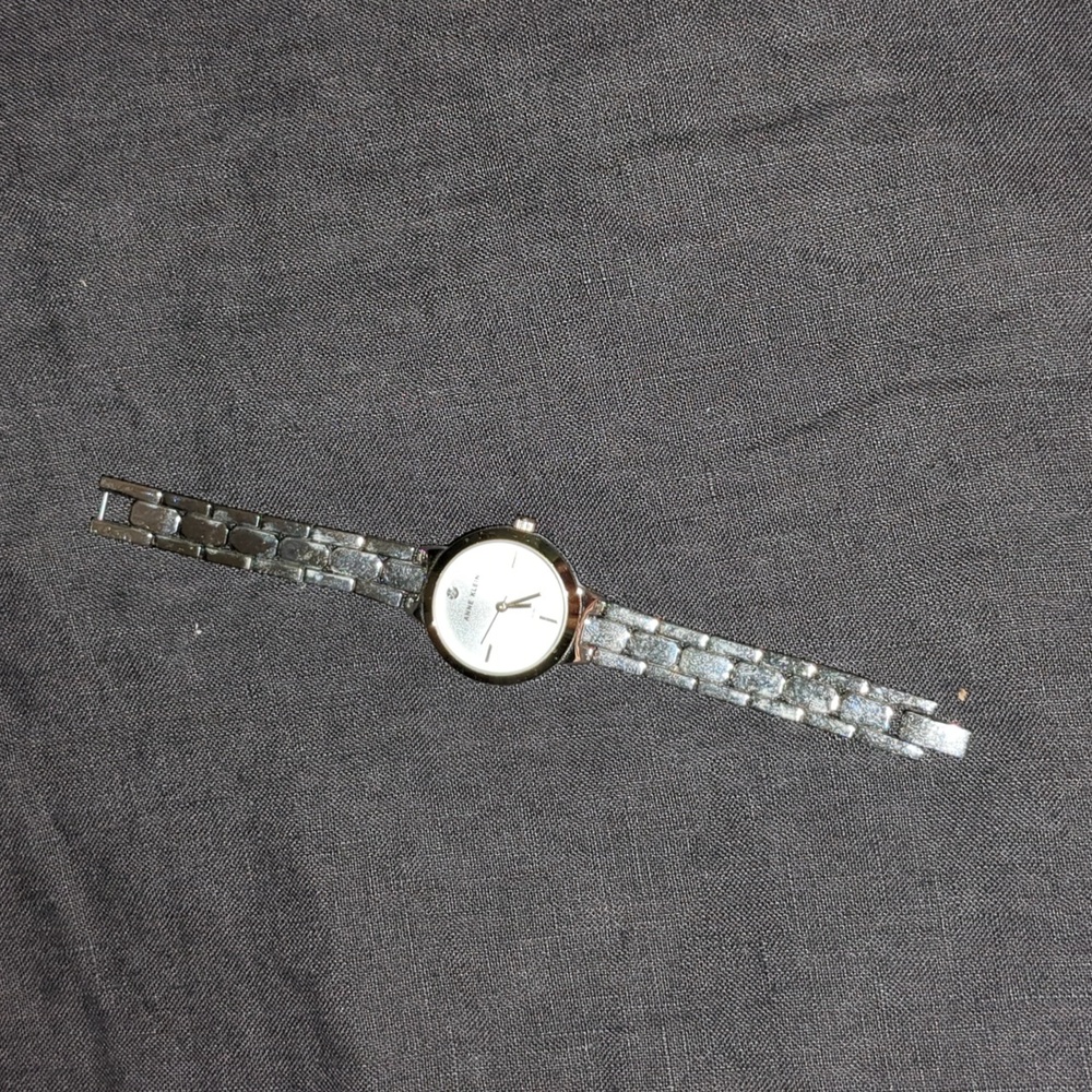 Anne Kline watch silver band gold face boarder diamond on face watch